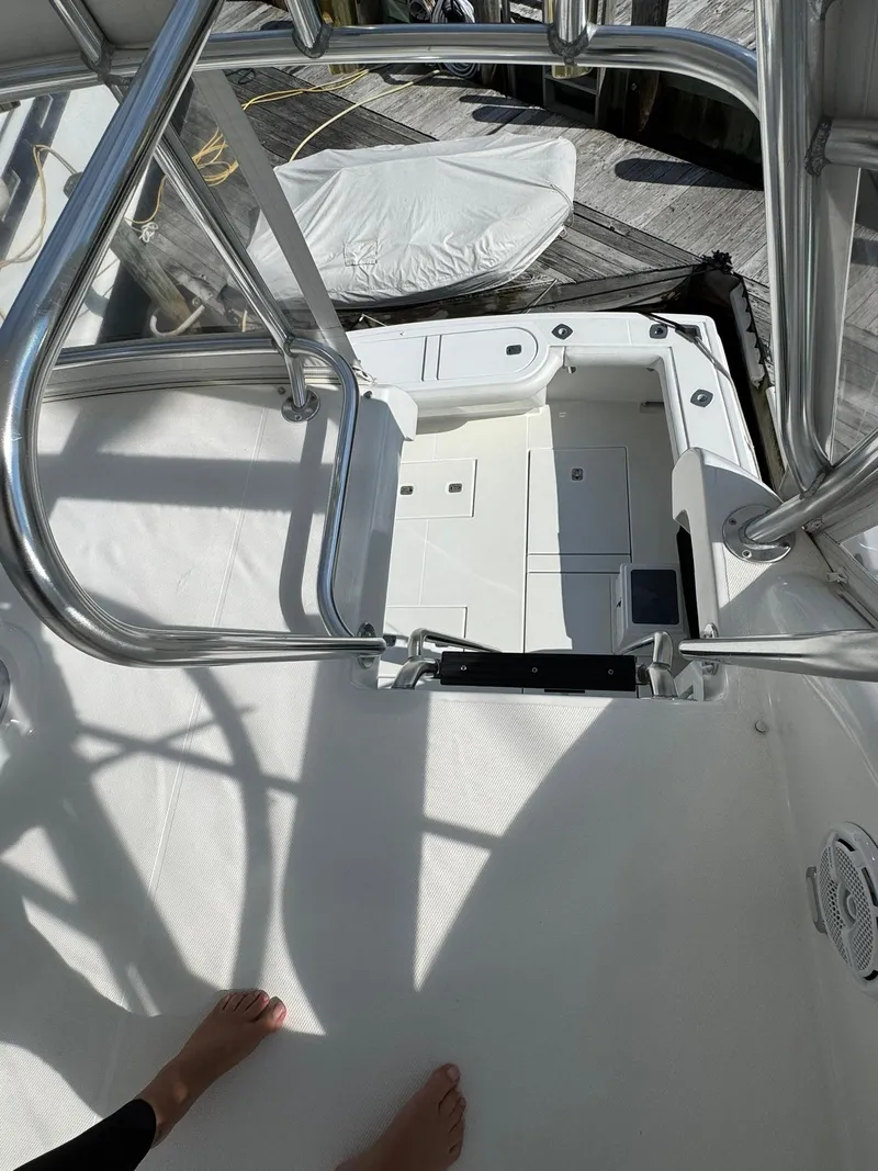 Slide: The Image of 2003 Rampage 45 Convertible boat deck with stainless steel railings and white flooring. - 41