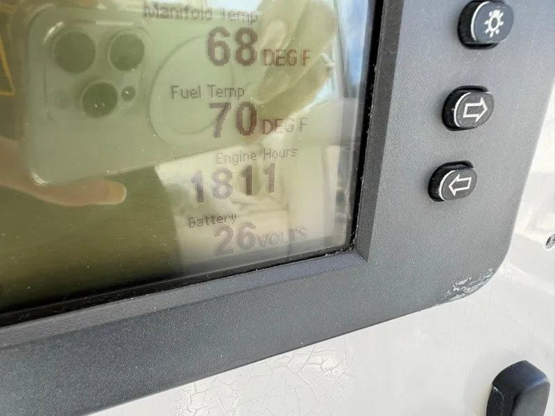 Slide: The Image of Display screen showing engine data: manifold temp 68°F, fuel temp 70°F, engine hours 1811. - 45