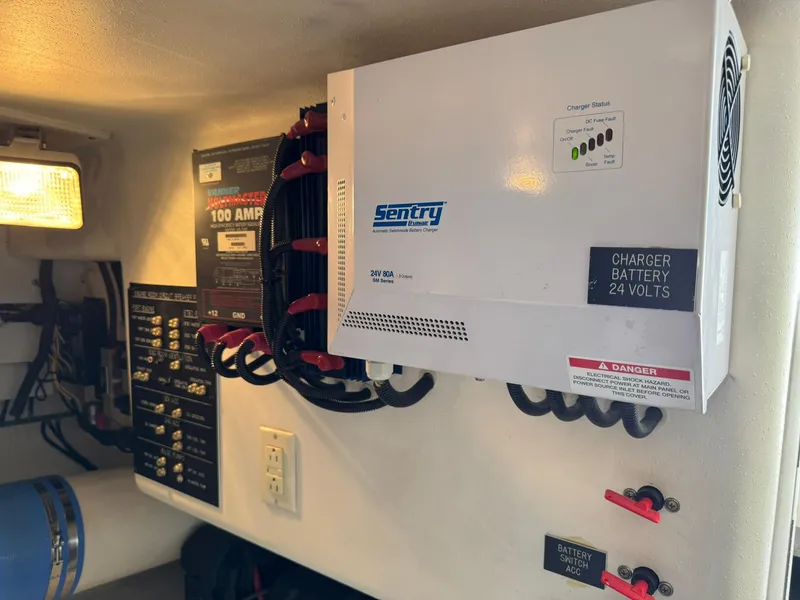 Slide: The Image of Electrical panel with Sentry battery charger in 2003 Rampage 45 Convertible boat. - 47