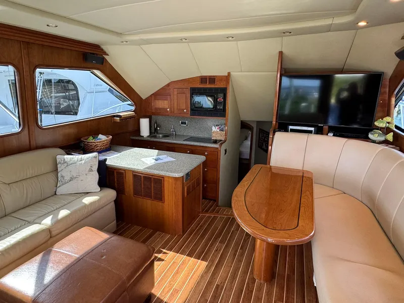 Slide: The Image of Luxurious interior of a 2003 Rampage 45 Convertible yacht with elegant wood finishes. - 8