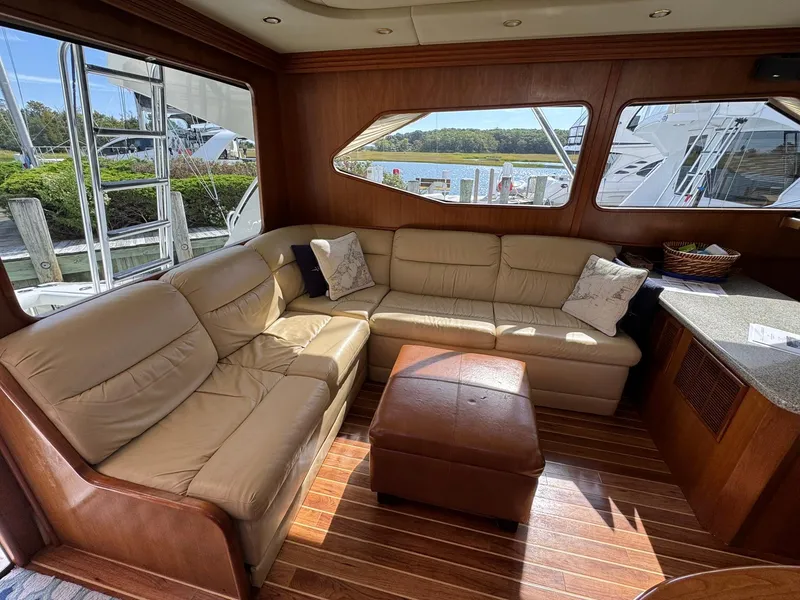 Slide: The Image of Luxurious interior of 2003 Rampage 45 Convertible yacht with leather seating and wooden flooring. - 9