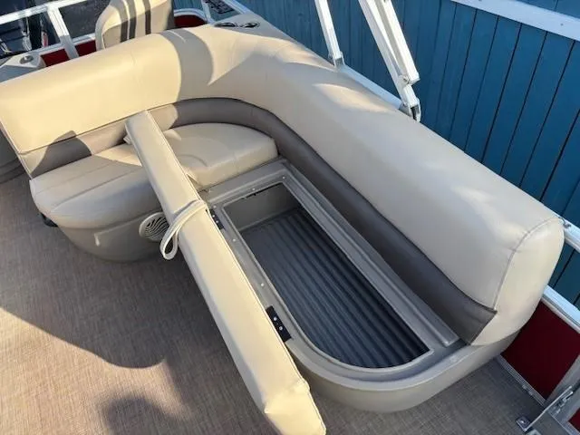 Slide: The Image of 2023 Sun Tracker Bass Buggy 18 DLX pontoon boat with open storage compartment. - 18