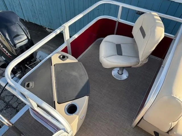 Slide: The Image of 2023 Sun Tracker Bass Buggy 18 DLX boat interior with seating and console. - 21