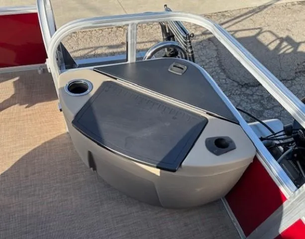 Slide: The Image of 2023 Sun Tracker Bass Buggy 18 DLX boat console with cup holder and storage. - 22