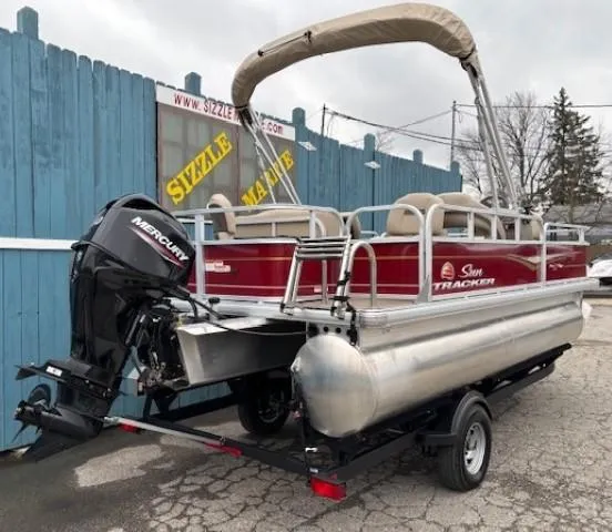 Slide: The Image of 2023 Sun Tracker Bass Buggy 18 DLX pontoon boat with Mercury engine on trailer. - 3