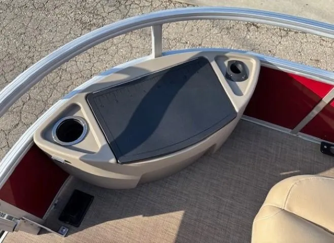 Slide: The Image of 2023 Sun Tracker Bass Buggy 18 DLX boat interior with cup holders and seating. - 6