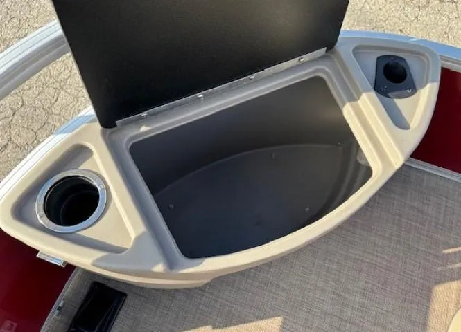 Slide: The Image of 2023 Sun Tracker Bass Buggy 18 DLX storage compartment with cup holders. - 7