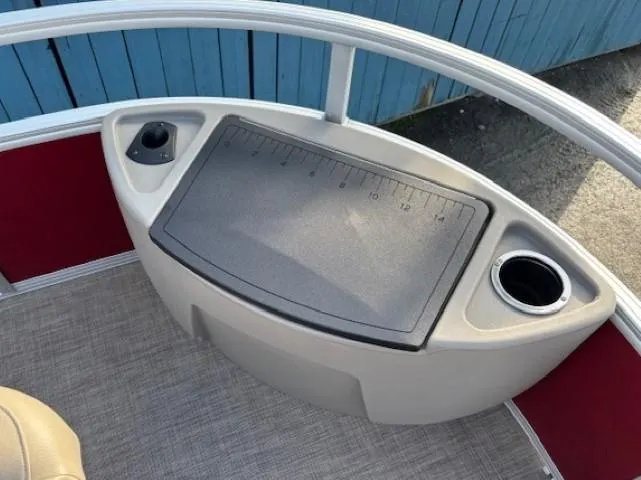 Slide: The Image of 2023 Sun Tracker Bass Buggy 18 DLX fishing station with cup holders and measuring board. - 8