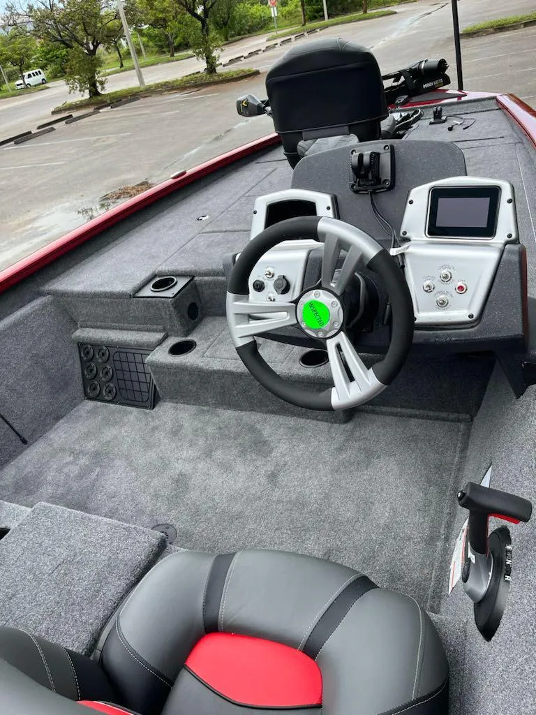 Slide: The Image of 2025 Tracker Pro Team 195 Tournament Edition boat interior with steering wheel and dashboard. - 2