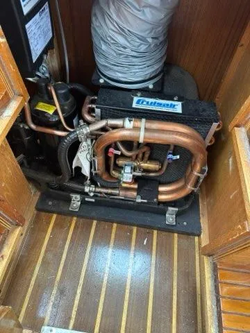 Slide: The Image of Engine room of 1986 Custom C. Raymond Hunt Design Yacht with copper piping and equipment. - 20