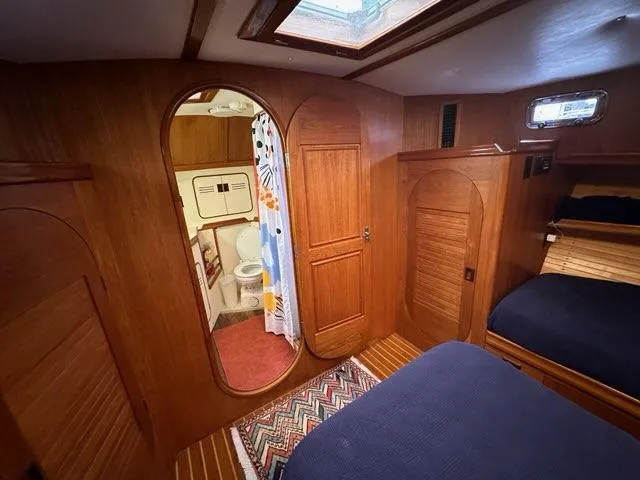 Slide: The Image of Interior of 1986 C. Raymond Hunt Design Yacht with wooden paneling and cozy cabin. - 22