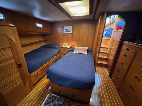 Slide: The Image of Luxurious 1986 C. Raymond Hunt Design yacht cabin with twin beds and wooden interior. - 26