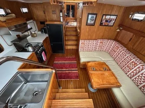 Slide: The Image of Interior of 1986 C. Raymond Hunt Design Yacht with kitchen and cozy seating area. - 34