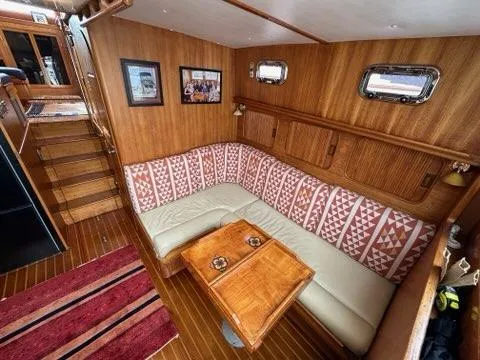Slide: The Image of Interior of 1986 C. Raymond Hunt Design Yacht with cozy seating and wooden decor. - 36