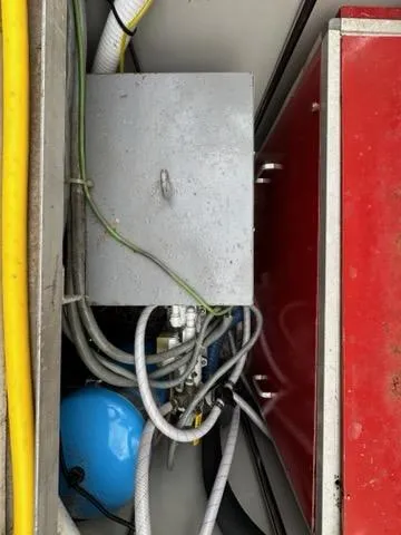 Slide: The Image of Electrical components and wiring inside a 1986 C. Raymond Hunt Design Yacht. - 45