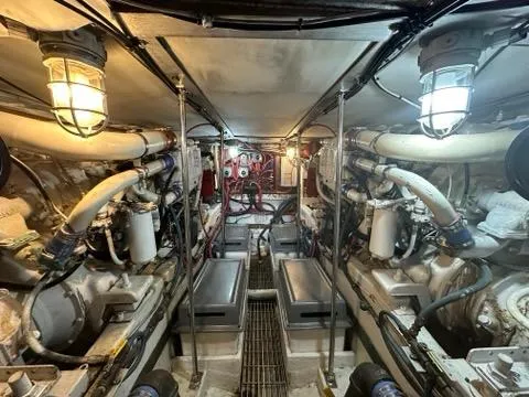 Slide: The Image of Engine room of 1986 C. Raymond Hunt Design Yacht, featuring complex machinery and lighting. - 46