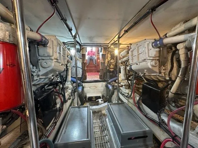 Slide: The Image of Engine room of 1986 C. Raymond Hunt Design Yacht, showcasing dual engines and mechanical systems. - 47