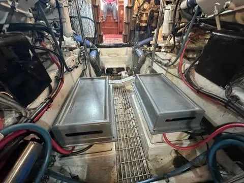 Slide: The Image of Engine room of 1986 C. Raymond Hunt Design Yacht with visible machinery and wiring. - 48