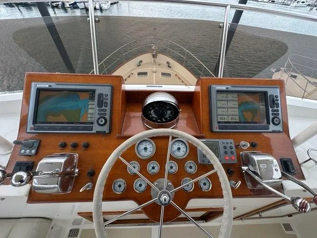 Slide: The Image of Helm of 1986 C. Raymond Hunt Design Yacht with navigation screens and controls. - 8