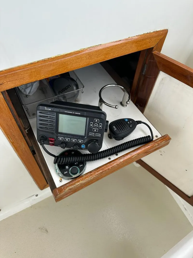Slide: The Image of Marine radio equipment in a wooden cabinet on a 1986 C. Raymond Hunt Design Yacht. - 9