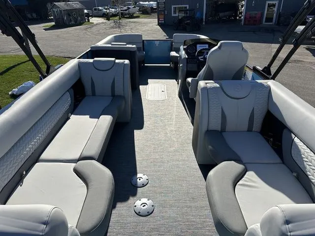 Slide: The Image of 2025 Godfrey Monaco 235SB pontoon boat interior with plush seating and modern design. - 3