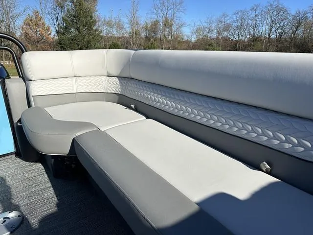 Slide: The Image of 2025 Godfrey Monaco 235SB boat interior with luxurious seating and elegant design. - 5