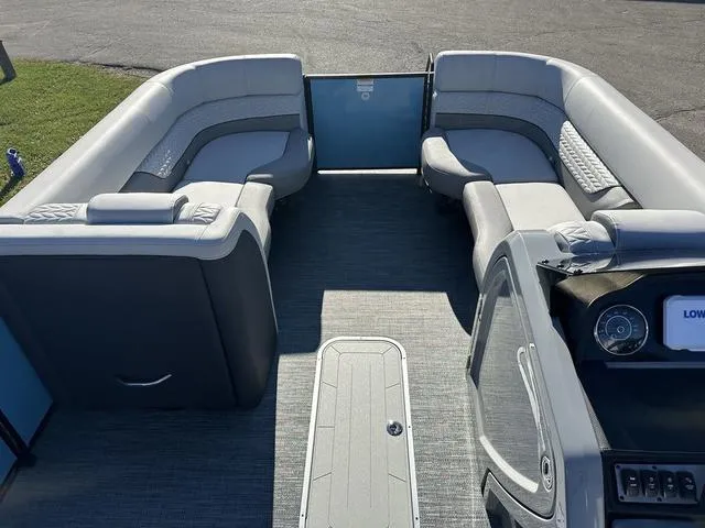 Slide: The Image of 2025 Godfrey Monaco 235SB boat interior with spacious seating and modern design. - 6