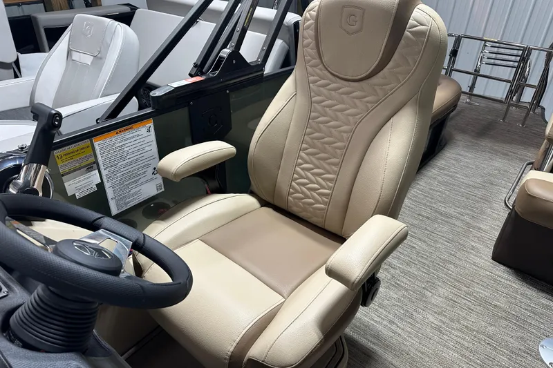 Slide: The Image of Captain's chair in 2025 Godfrey MONACO 235 SFL boat, featuring luxurious beige upholstery. - 8