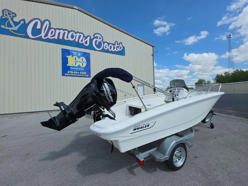 Slide: The Image of 2025 Boston Whaler 130 Super Sport boat on trailer at Clemons Boats dealership. - 3