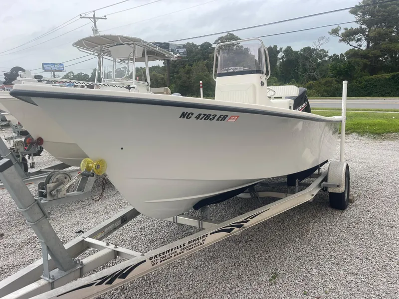 Slide: The Image of 2021 May-Craft 19 Cape Classic boat on trailer, parked on gravel lot. - 5