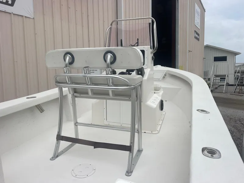 Slide: The Image of 2021 May-Craft 19 Cape Classic boat, white interior, docked near a warehouse. - 9