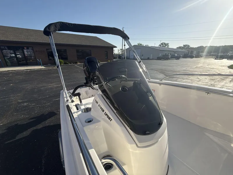 Slide: The Image of 2025 Boston Whaler 130 Super Sport boat with sleek design and modern features. - 7