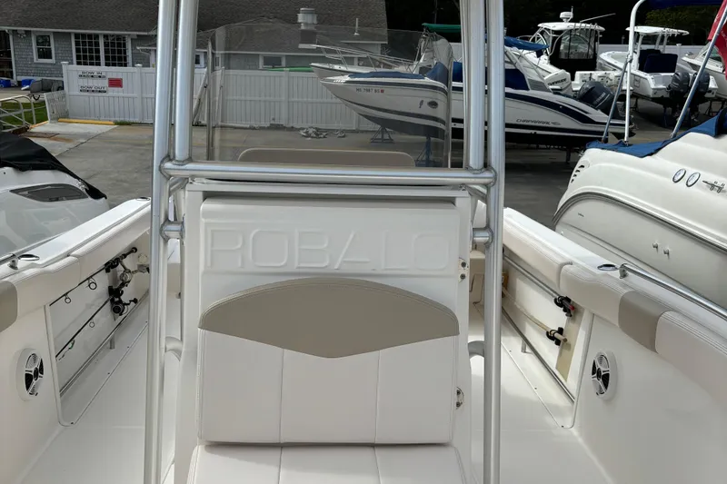 Slide: The Image of 2016 Robalo R222 Center Console boat interior with seating and storage. - 14