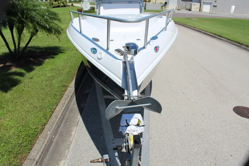 Slide: The Image of 2009 Donzi 35 ZFX Cuddy boat on trailer, parked on a residential street. - 19