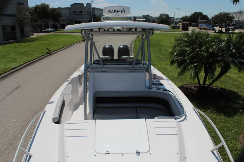 Slide: The Image of 2009 Donzi 35 ZFX Cuddy boat with Garmin equipment, docked on a sunny day. - 22