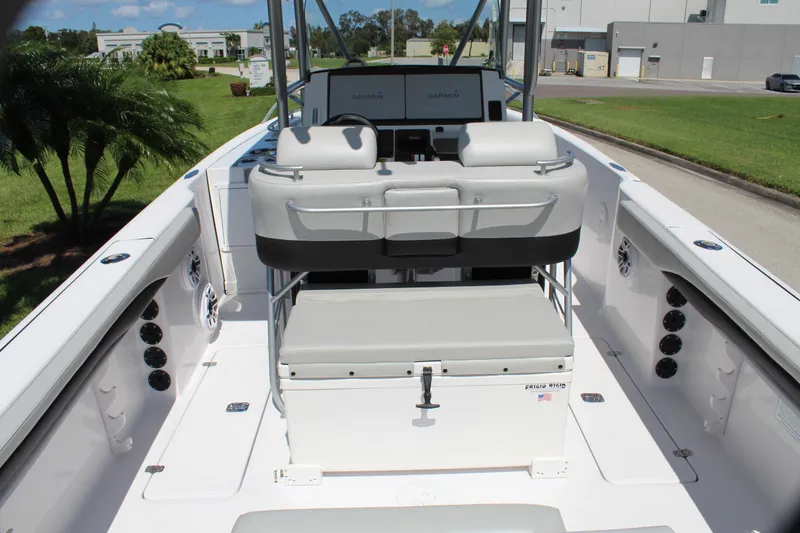 Slide: The Image of 2009 Donzi 35 ZFX Cuddy boat interior with seating and console. - 35