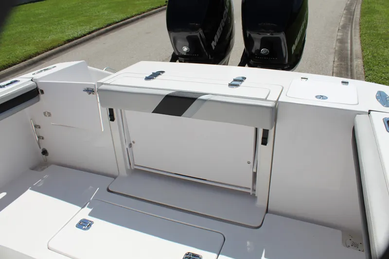 Slide: The Image of 2009 Donzi 35 ZFX Cuddy boat deck with storage and dual engines. - 36