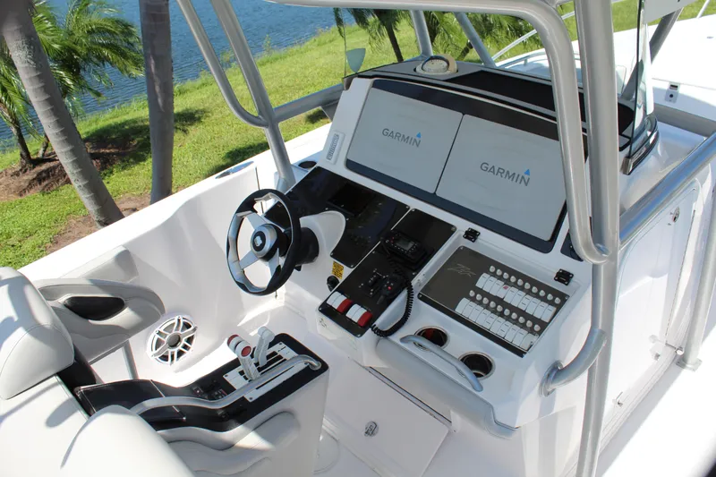 Slide: The Image of 2009 Donzi 35 ZFX Cuddy boat cockpit with Garmin navigation system. - 48