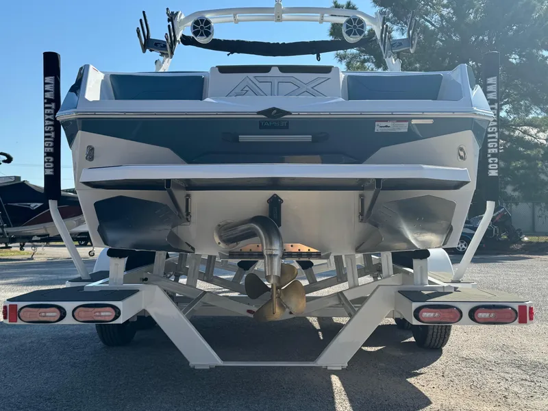 Slide: The Image of 2025 ATX Surf Boats 22 Type-S, rear view on trailer, showcasing sleek design and features. - 3