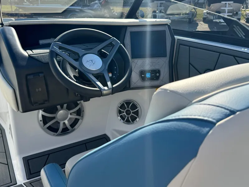 Slide: The Image of 2025 ATX Surf Boats 22 Type-S dashboard with steering wheel and control panel. - 7