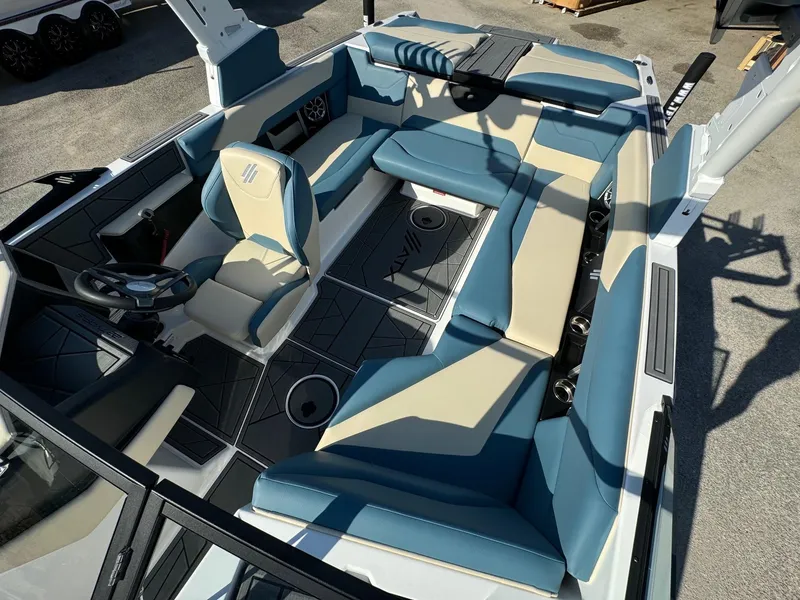 Slide: The Image of 2025 ATX Surf Boats 22 Type-S interior with blue and beige seating, modern design. - 9