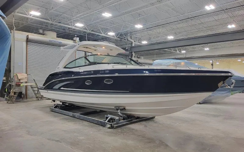 The Image of 2025 Formula 330 CBR boat in a spacious indoor showroom. - 0