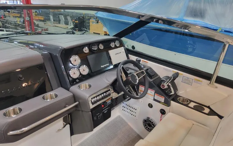 Slide: The Image of 2025 Formula 330 CBR boat cockpit with modern controls and steering wheel. - 21