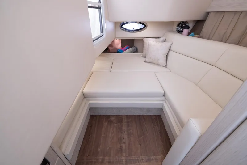 Slide: The Image of 2025 Formula 330 CBR cabin interior with white leather seating and wood flooring. - 40