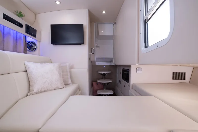 Slide: The Image of Luxurious interior of 2025 Formula 330 CBR boat with modern seating, TV, and ambient lighting. - 42