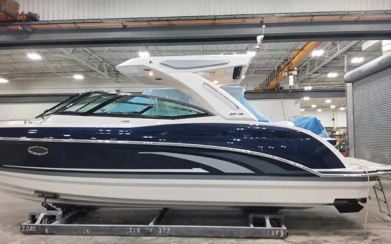 Slide: The Image of 2025 Formula 330 CBR boat in a warehouse setting. - 5