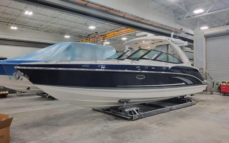 Slide: The Image of 2025 Formula 330 CBR boat in a warehouse setting. - 6