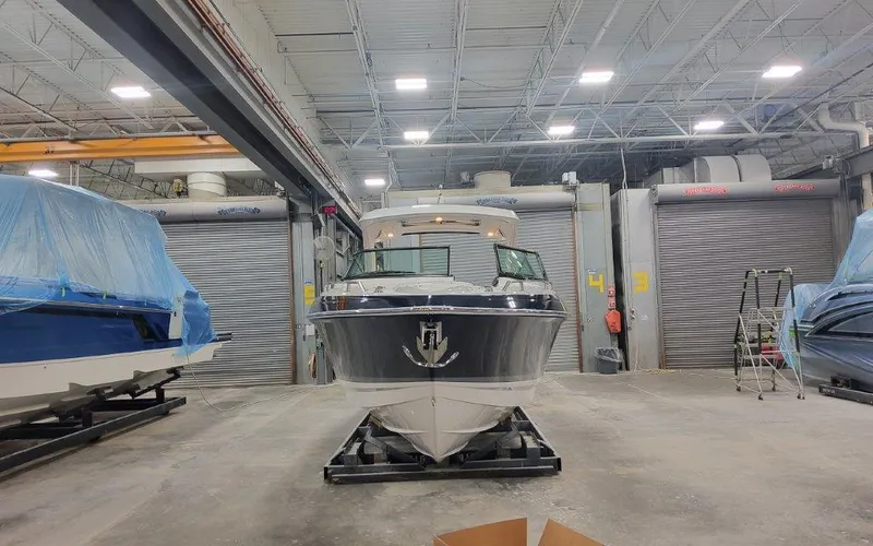 Slide: The Image of 2025 Formula 330 CBR boat in a warehouse, front view. - 7