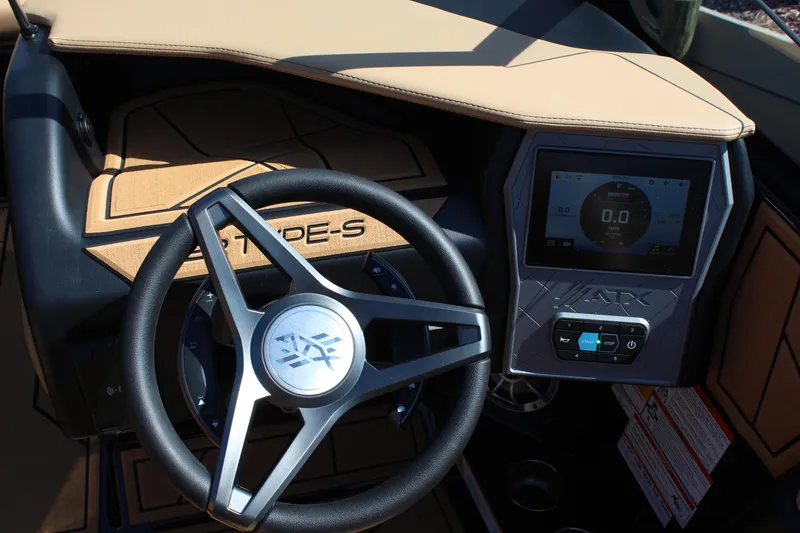 Slide: The Image of 2025 ATX Surf Boats 22 Type-S dashboard with steering wheel and digital display. - 16