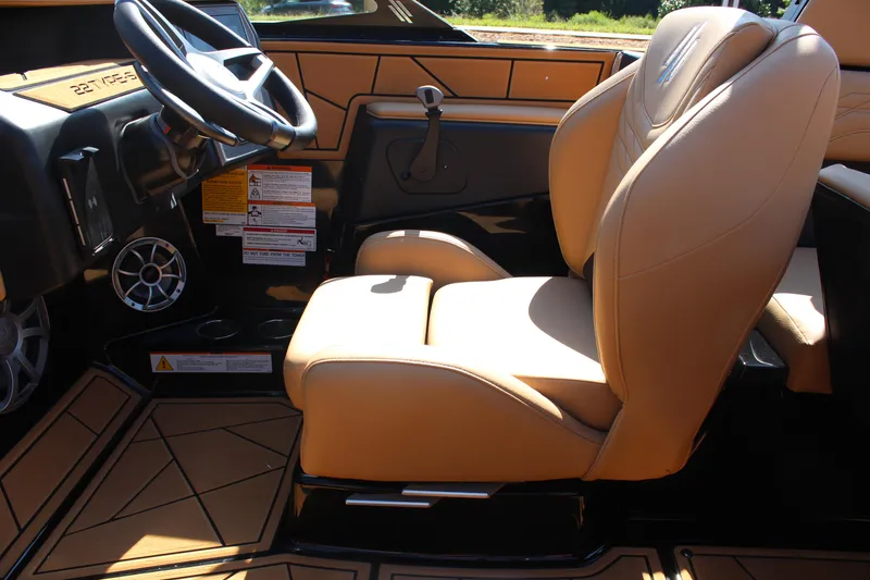 Slide: The Image of 2025 ATX Surf Boats 22 Type-S interior with tan leather seats and modern dashboard. - 21